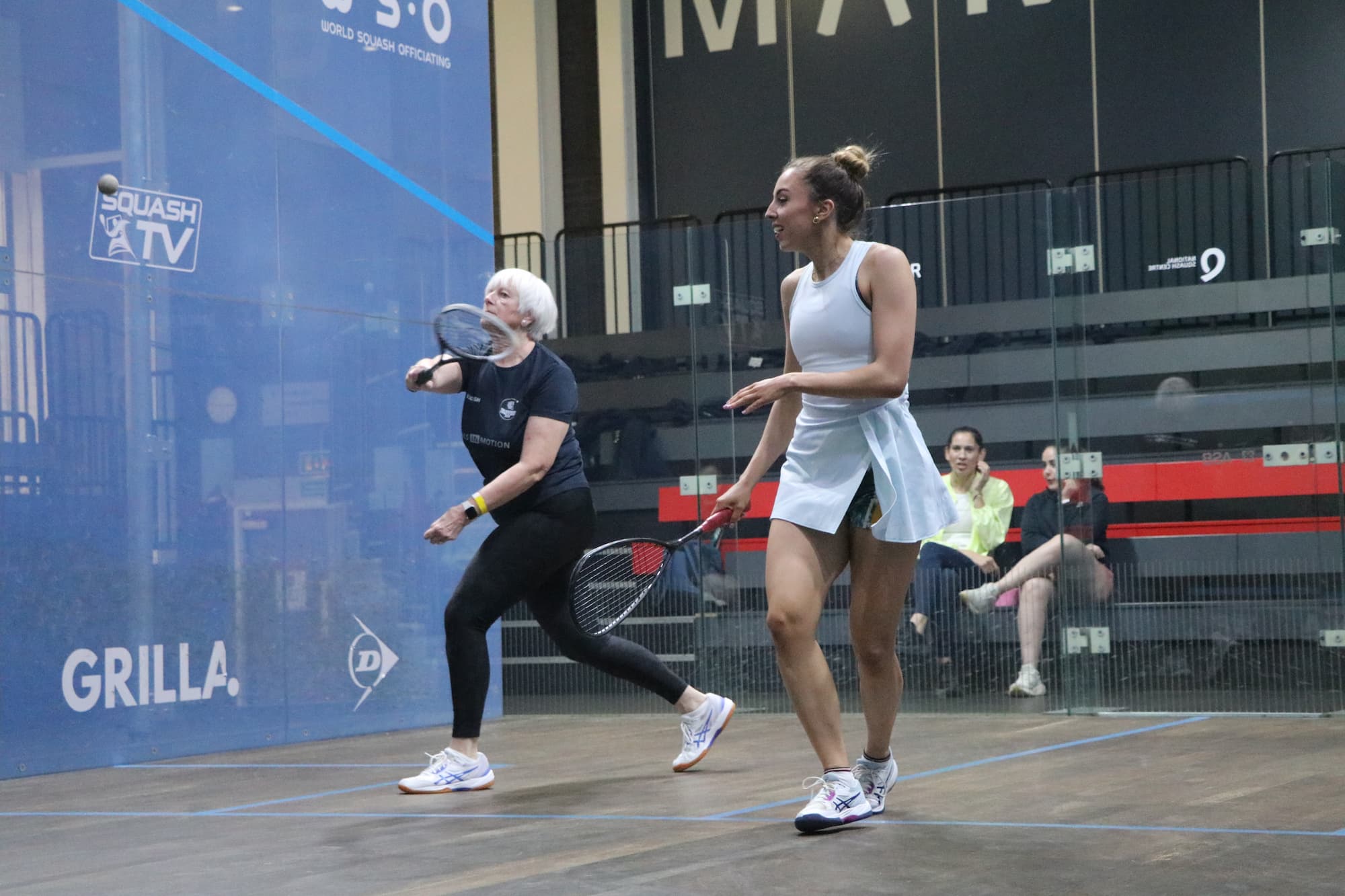 An elite squash player training on court during a Courter Pro day